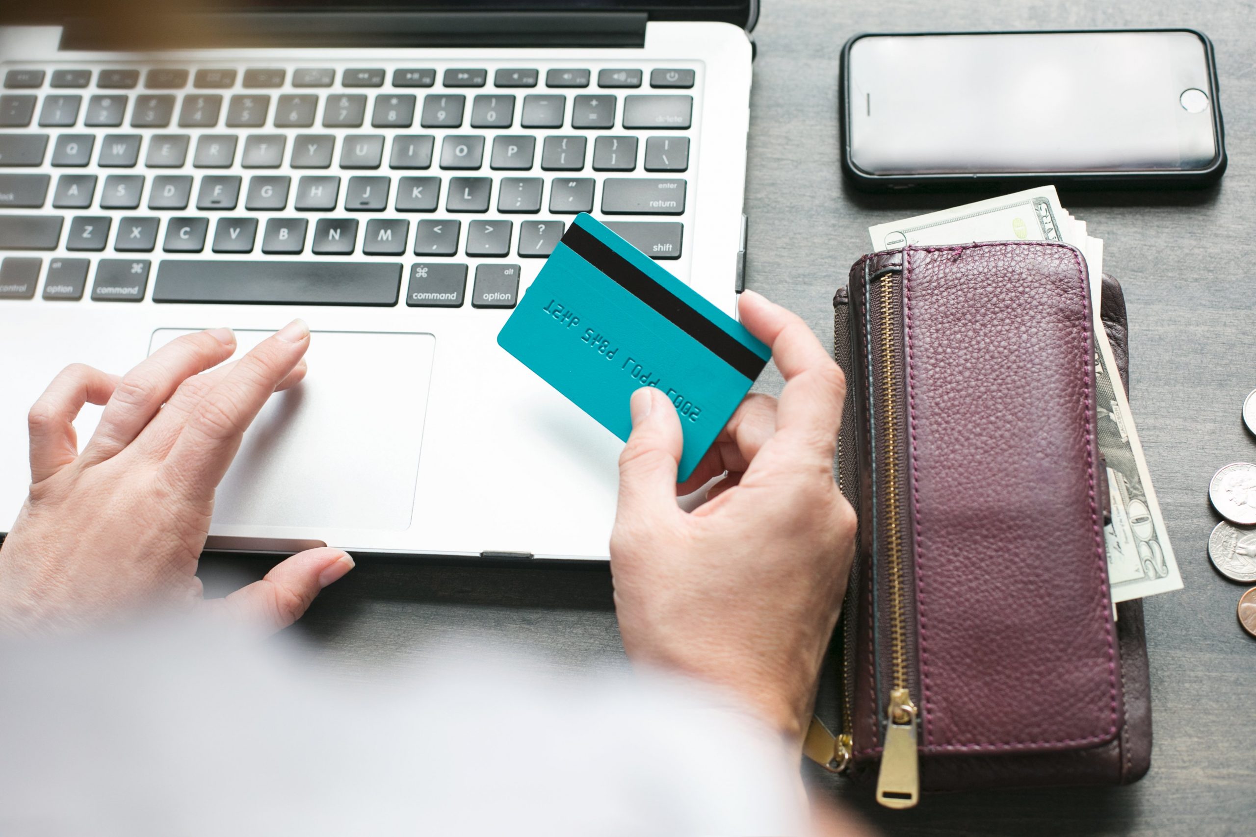 Man holding credit card shopping online